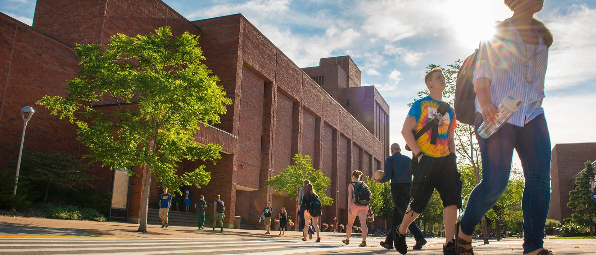 Students walking on campus on a summer day